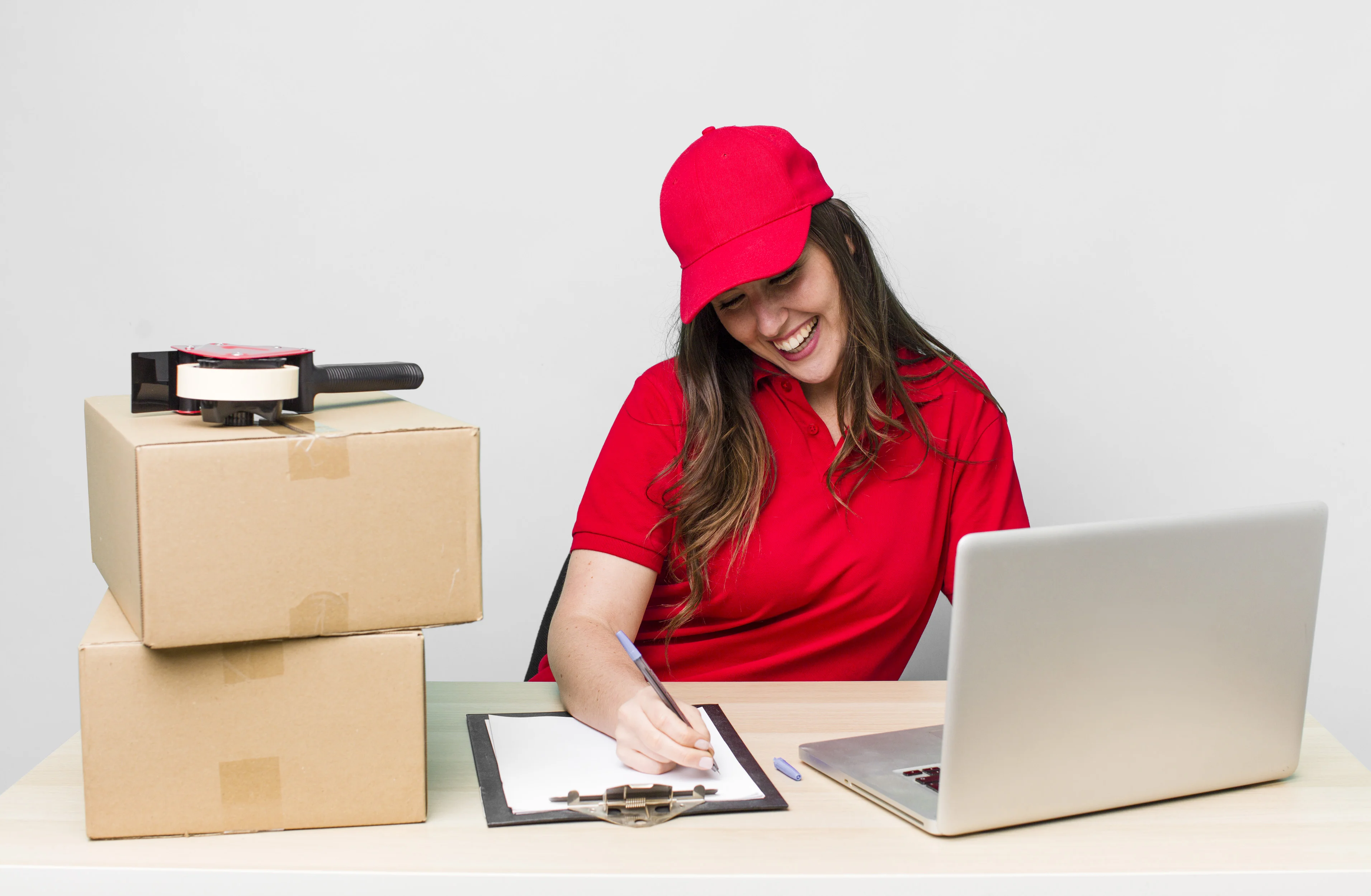 Person using a laptop to track a shipment on a digital map, illustrating Ashoka Computer's streamlined order processing and dispatch system for efficient courier tracking and delivery updates